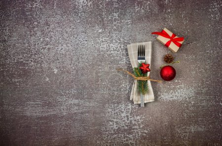 Photo for Christmas background with Cutlery Set and baubles on conkrete background. New Year's Eve dinner concept, free space for text. - Royalty Free Image