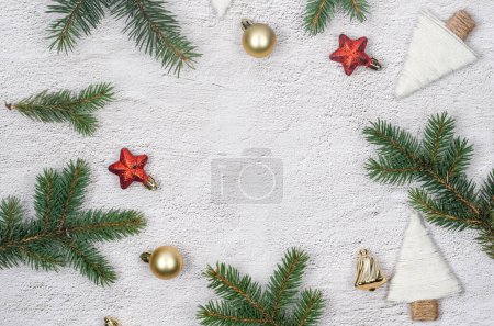 Photo for Christmas and New Year holiday background. Xmas greeting card. Christmas gifts boxes wrapping in craft paper and pine branches on conkrete background top view. Noel. - Royalty Free Image
