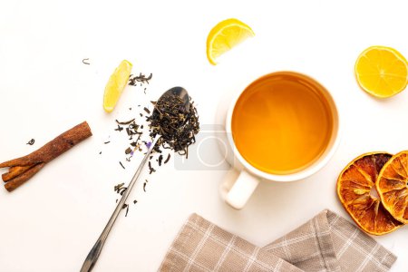 Photo for Tea composition teapot and teacup with tea bags on white table. Flat lay. Top view. - Royalty Free Image
