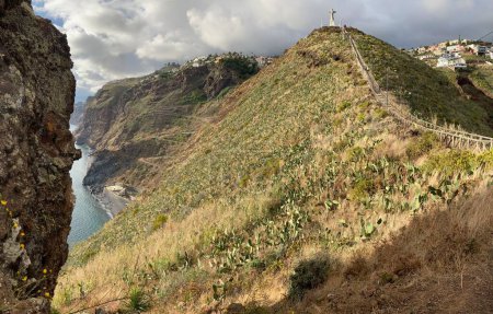 Photo for Statue of Jesus Christ on a hill at Garajau. Funchal, Madeira, Portugal. Panoramic view. - Royalty Free Image