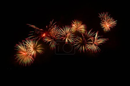 Photo for Colorful Fireworks Isolated on black sky background. Isolated firework ready to use for decoration in any photograph ,poster, backdrop to celebrate the festival, Christmas,  New year and any events. - Royalty Free Image