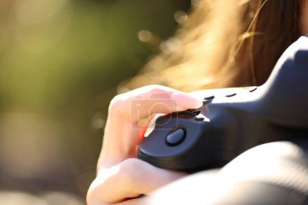 Close up of a photographer finger adjusting shutter speed with dial on mirrorless camera