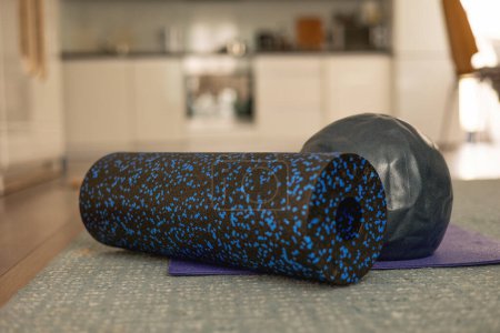 MFR roll, Pilates ball and Pilates mat. Exercising at home