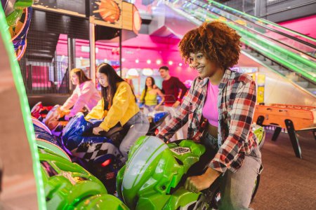 Joyful young woman riding a motorcycle simulator at a vibrant indoor amusement arcade.