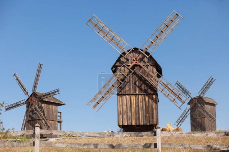 Photo for 3 old windmills in the field, close up - Royalty Free Image