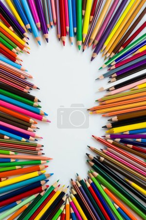 Téléchargez les photos : Various colorful crayons designed on white surface with copy space - en image libre de droit