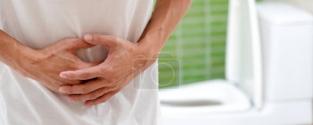 stomach ache. Asian men have abdominal pain, indigestion, gastritis, menstrual cramps, flatulence, diarrhea, distention, colon cancer, belly inflammation problem, suffer food poisoning, abdomen