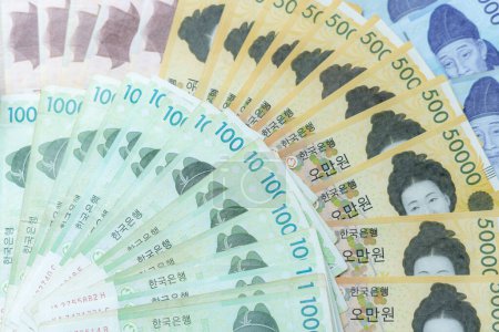 Photo for The currency of Korea which is used to represent value in exchange and the won is the main currency of Korean people. Korean won notes for money concept background. - Royalty Free Image