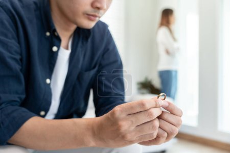 Divorce. Man remove married ring. Couples desperate and disappointed after marriage. Husband wife sad, upset and frustrated after quarrels conflict. distrust, love problems, betrayals, family, lover