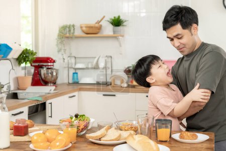 activities together during the holidays. Parents and children are having a meal together during the holidays. father play for son on morning, enjoy, weekend, vacant, family time, happy.