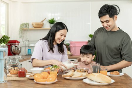 family time, breakfast, activities together during the holidays. Parents and children are having a meal together during the holidays. New home for family on morning, enjoy, weekend, vacant time