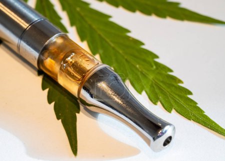 CBD vaporizer with a cannabis leaf isolated