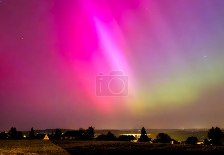 northern lights over the field in the night in Vogtland Reichenbach germany