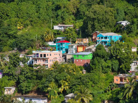 Kingstown, St Vincent - Jan 29 2024: Colourful houses near surrounded by lush greenery in Kingstown on the island of St Vincent in the Caribbean.