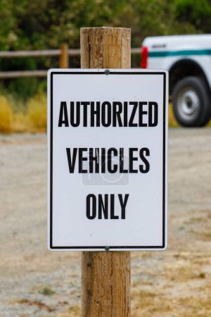Photo for Authorized Vehicles Only sign on a wooden post - Royalty Free Image