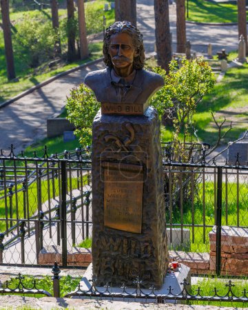 Photo for Mount Moriah Cemetery, Deadwood, South Dakota, USA  - May 19 2023: Statue of Wild Bill Hickok at his grave in Deadwood South Dakota. - Royalty Free Image