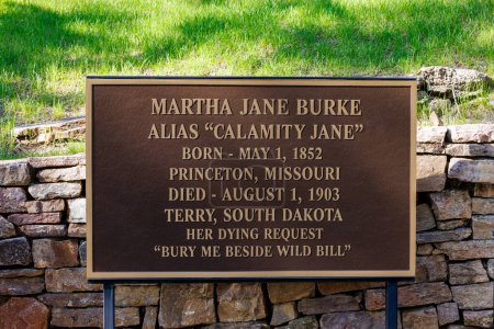 Photo for Mount Moriah Cemetery, Deadwood, South Dakota, USA  - May 19 2023: Sign about Calamity Jane at her grave in Deadwood South Dakota. - Royalty Free Image