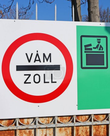 Photo for Customs sign on a fence outdoor. Zoll is meaning customs in german, Vam is the same in hungarian - Royalty Free Image
