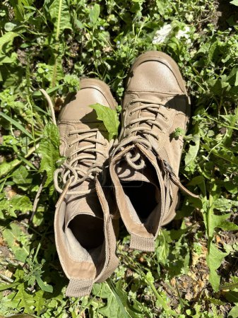Old shoes in the green plants