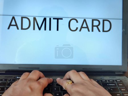 Photo for Picture of a person searching for admit card of an entrance exam on a laptop. Admit Card is written on screen. - Royalty Free Image