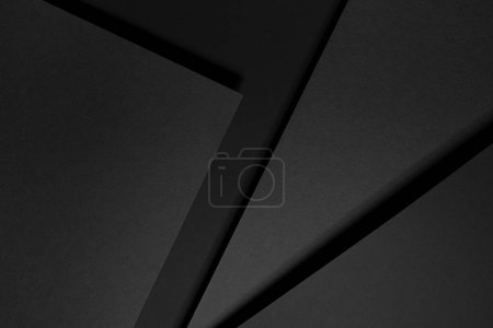 Fond géométrique abstrait gris foncé avec des espaces rectangle, des rayures, des lignes, des coins en lumière dure avec des ombres noires dans un style moderne strict simple pour carte de visite, affiche, flyer, vue de dessus.