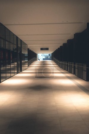 Photo for Front view of office corridor with warm lighting - Royalty Free Image