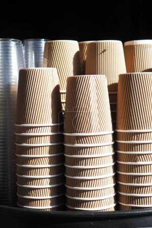  stacks of stacked clean craft cups for hot drinks .