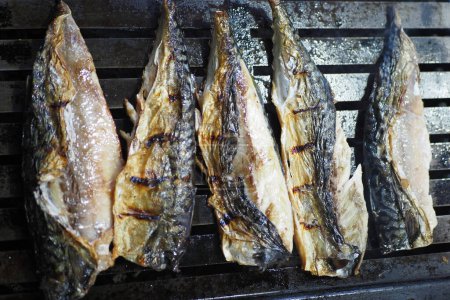 Photo for Baking and roasting fish on barbecue grill - Royalty Free Image