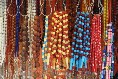 A bunch of colorful beads hanging for display
