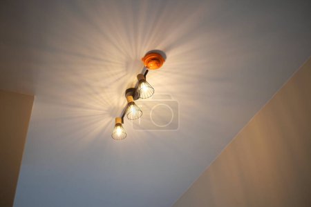 A light fixture is suspended from the ceiling, illuminating the room.