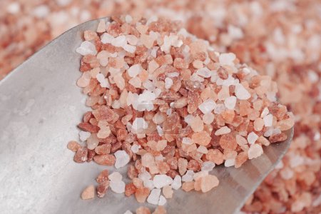 Raw dried pink Himalayan salt .