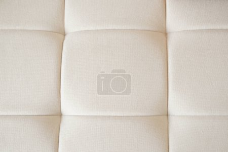 a texture of leather gray sofa with buttons ,