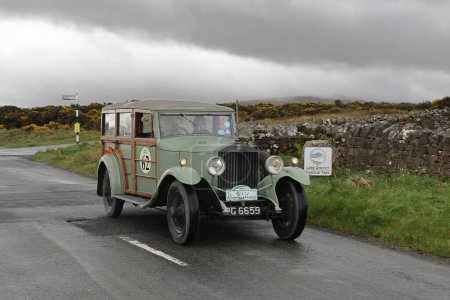 Photo for A 1929 Rolls Royce 20-25 leaves Caldbeck, Cumbria in the Flying Scotsman Rally, a free public-event. - Royalty Free Image