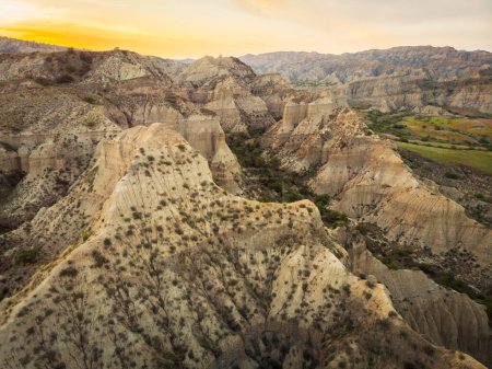 Photo for Surreal dramatic deserted earth landscape panorama with beautiful cliff formations and golden sunset background in Vashlovani national park. Travel Georgia destination. - Royalty Free Image