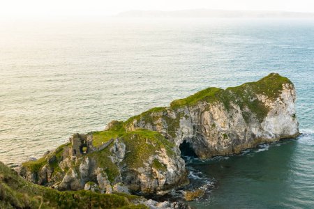 Photo for Kinbane castle ruins in northern ireland coast with calm blue sea in background - Royalty Free Image