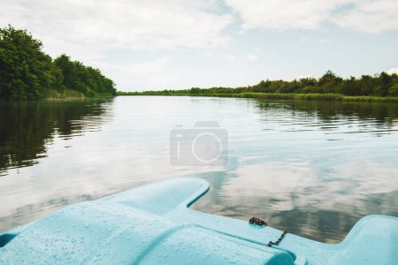 Photo for Blue pedal boat together in Kolkheti national park in cloudy summer day. Famous sightseeing destination Batumi - Royalty Free Image