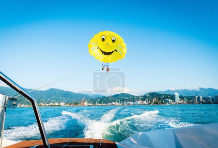 Photo for Couple do para sailing touch water.Para-sailing and safety in water sports - Royalty Free Image