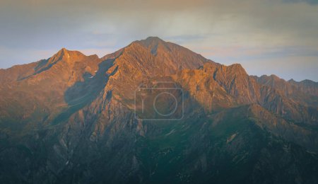 Skhara mountain peak on sunset from udziro lake trekking viewpoint in Georgia. Caucasus mountain landscape
