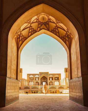 Kashan, Iran - 29th may, 2022: Tourists and pilgrims explore sightseeing beautiful Agha Bozorg Mosque
