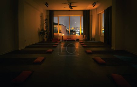 11th november, 2019 - Balat, Istanbul, Turkey: Background image of empty yoga center. Pillows with mattress, ambient light and window to big city Istanbul. Hara yoga center