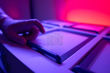 Photo for Employee of the genetic laboratory checking incubator with embryos after vitrification, maintains the desired temperature - Royalty Free Image