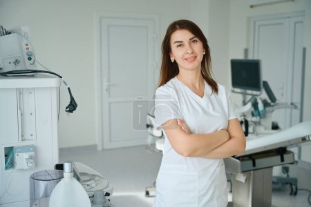 Photo for Portrait of beautiful female gynecologist in cabinet with new equipment at the clinic - Royalty Free Image