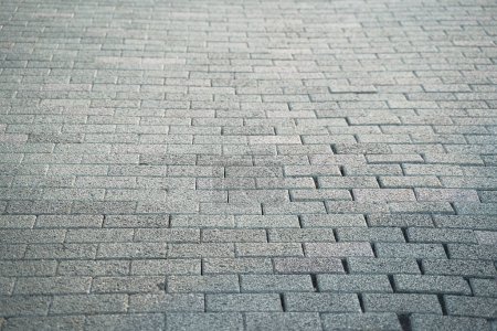 Photo for Close up view of walkway gray paving slabs material, selective focus. - Royalty Free Image