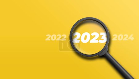 Photo for Magnifying glass magnifies the year 2023 between the years 2022 and 2024 on yellow background. Focusing on or analyzing the year 2023 for business planning concept. 3D illustration. - Royalty Free Image