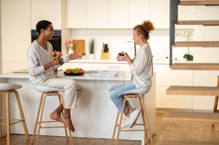 Photo for Morning together. Couple spending time together and having breakfast in the kitchen - Royalty Free Image