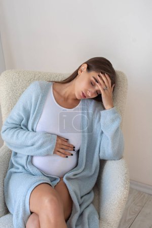 Photo for Headache. Young pregnant woman having a headache - Royalty Free Image
