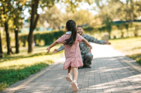 Photo for Reunion. Little girl looking running to her dad - Royalty Free Image