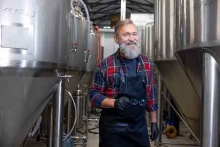 Photo for Brewery. Mature man in plaid shirt in a brewery factory - Royalty Free Image