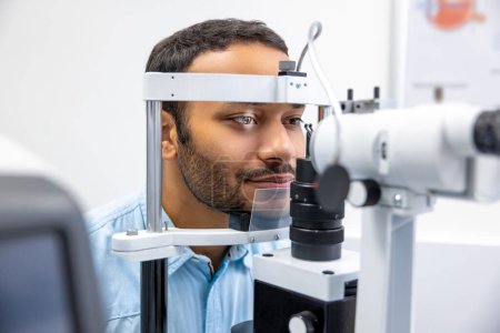 Photo for Ophtalmology. Young man having an examination in a ophtalmological clinic - Royalty Free Image