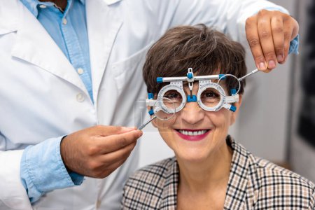 Photo for At clinic. Optometrist working with female patient at clinic - Royalty Free Image